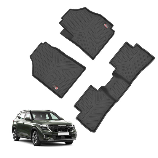 A set of three black GFX Life Long Car Floor Mats with textured patterns is shown above a green SUV. Designed for Kia Seltos 2023 onwards, these mats fit the front and rear interiors, offering custom protection.